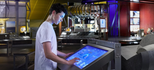 A picture of a student exploring the enery in an emergency exhibit at the museum.
