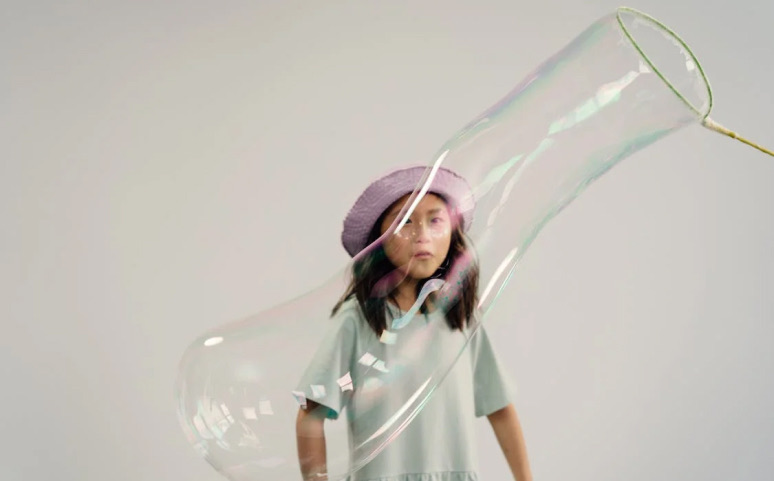 A picture of kid exploring the Big Bubble Experiment.