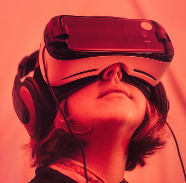 A picture of a girl using virtual reality glass